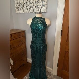 Full length sequence dress with rhinestone straps.
